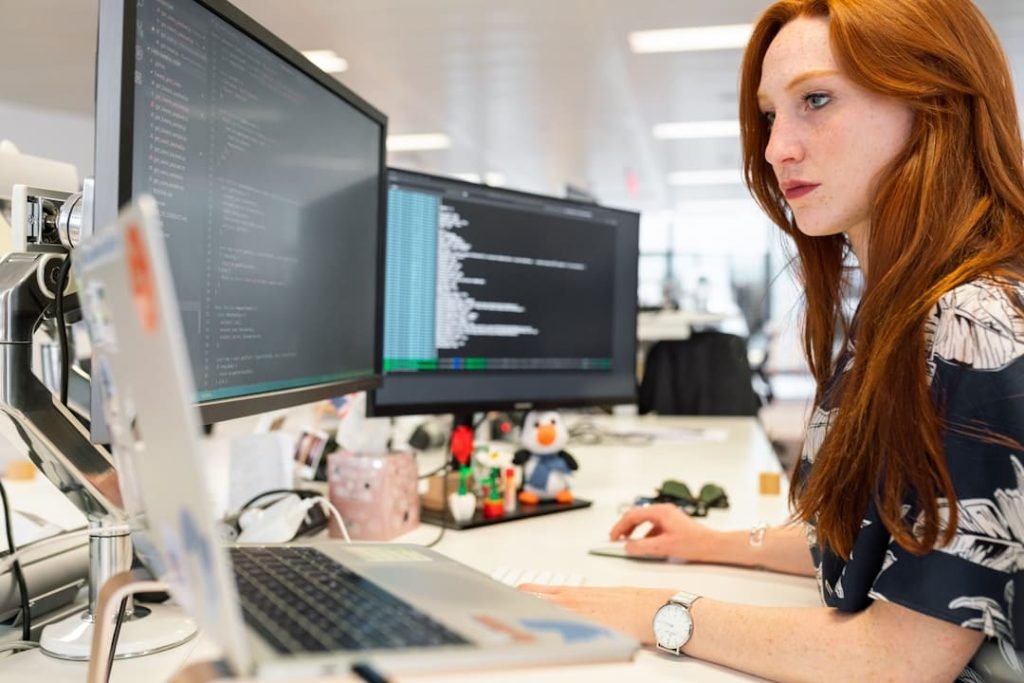 Ensuring Data Security and Compliance With Cloud Faxing 5 A female employee is utilizing cloud faxing for heightened security measures to send confidential documents.